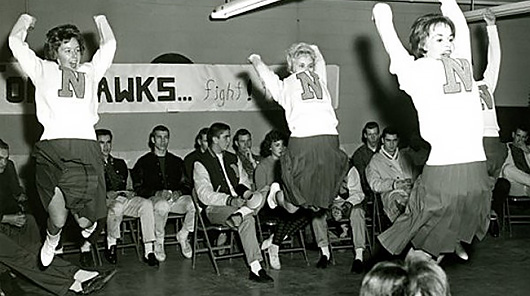 NMC cheerleaders at a 1950s sporting event