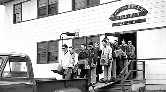 Students moving NMC equipment from its original airport location to its new Front Street campus