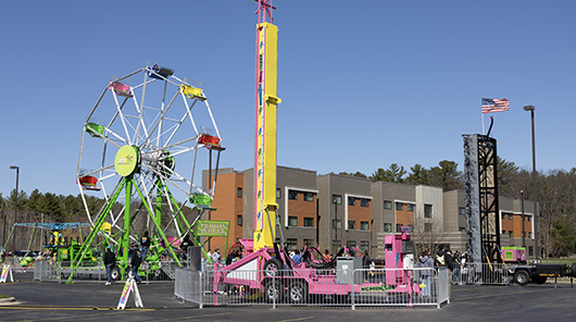 Carnival rides outside North Hall during Block Bash 2025