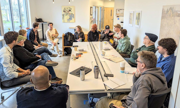 Photo of people gathered around a conference table