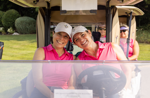 Golfer and clubs at the 2017 Scholarship Open