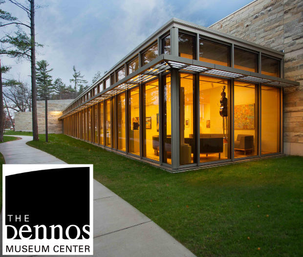 Photo of the exterior of the Dennos Museum Center at dusk