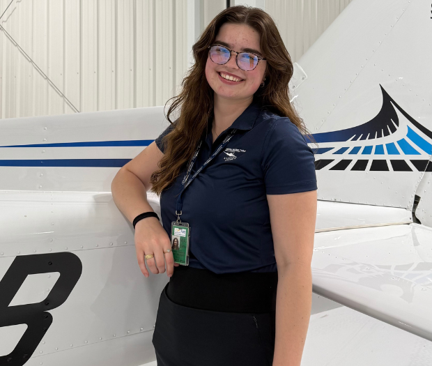 photo of Grace by a plane