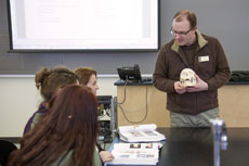 NMC photo of a science program instructor and students