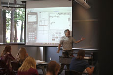 NMC photo of a math program instructor and in front of a class