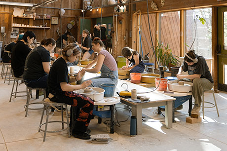 Fine Arts program students in a ceramics lab in the Fine Arts Building