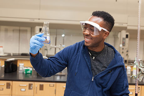 A Chemistry program student comes up with a solution in the lab