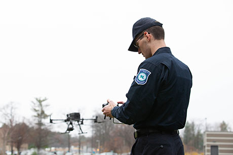 A Police Academy student pilots a drone
