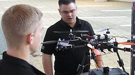 NMC students inspect a drone in an NMC Aviation program class