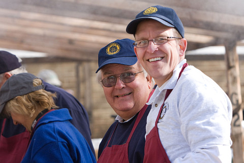 Volunteers grill buffalo burgers during the 2009 NMC Barbecue.