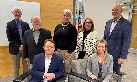 Photo of NMC board of trustees inside the Timothy J. Nelson Innovation Center