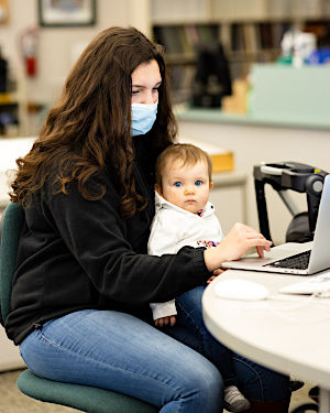 NMC Visual Communications program student Gabby Edgcombe and daughter Cozette