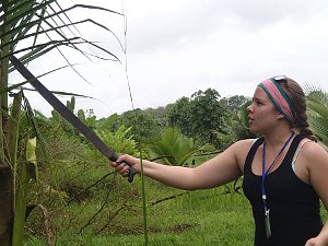 Costa Rica study abroad student Taylor West wields a machete