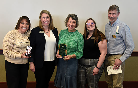 Public Relations department members Diana Fairbanks, Emily Crull (on phone), Kelly Yauk, Cari Noga, Deanna Silkowski and Steve Kellman