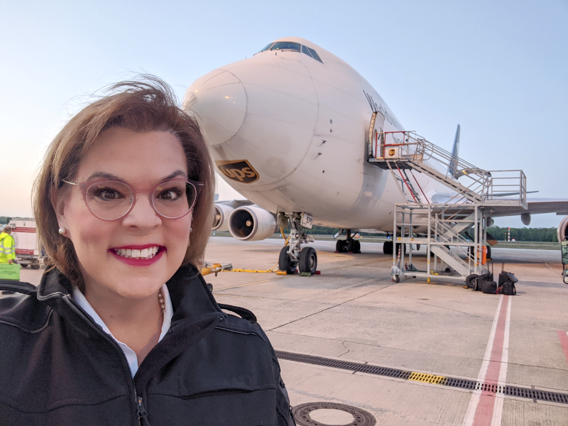 Kelly Lepley in front of plane