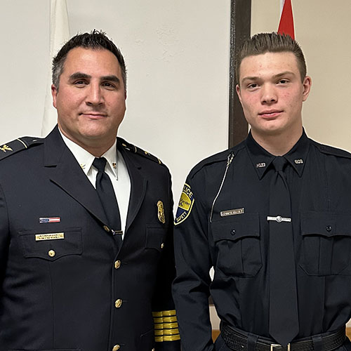 Manistee Police Chief Josh Glass and NMC Police Academy graduate Connor Rischel