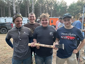 Auto Technology student Andrew Mikowski, left, and his Backwoods Baja teammates