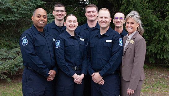 NMC Police Academy graduates pose with Police Academy Director Gail Kurowski