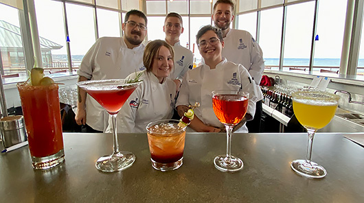 Students in the Great Lakes Culinary Institute's beverage management class show off their creations at Lobdell's Teaching Restaurant