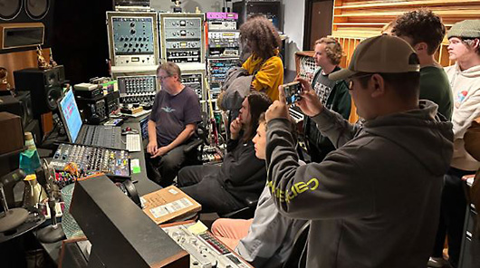 NMC Audio Technology program students view a music production studio in East Lansing.