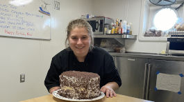 NMC culinary student Megan Cook bakes a cake aboard the Training Ship State of Michigan