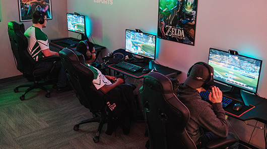 NMC Esports varsity team members compete in the college's Esports facility