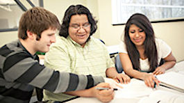 Three NMC international students collaborate on an assignment