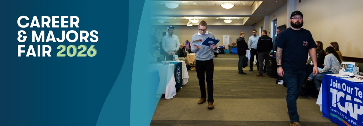 NMC students and others walking through the Career & Majors Fair and talking with employers