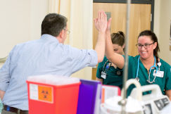 Instructor Mac Beeker giving high five to a nursing student