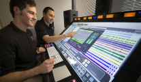 Students working on the state-of-the-art Raven MTX mixing console