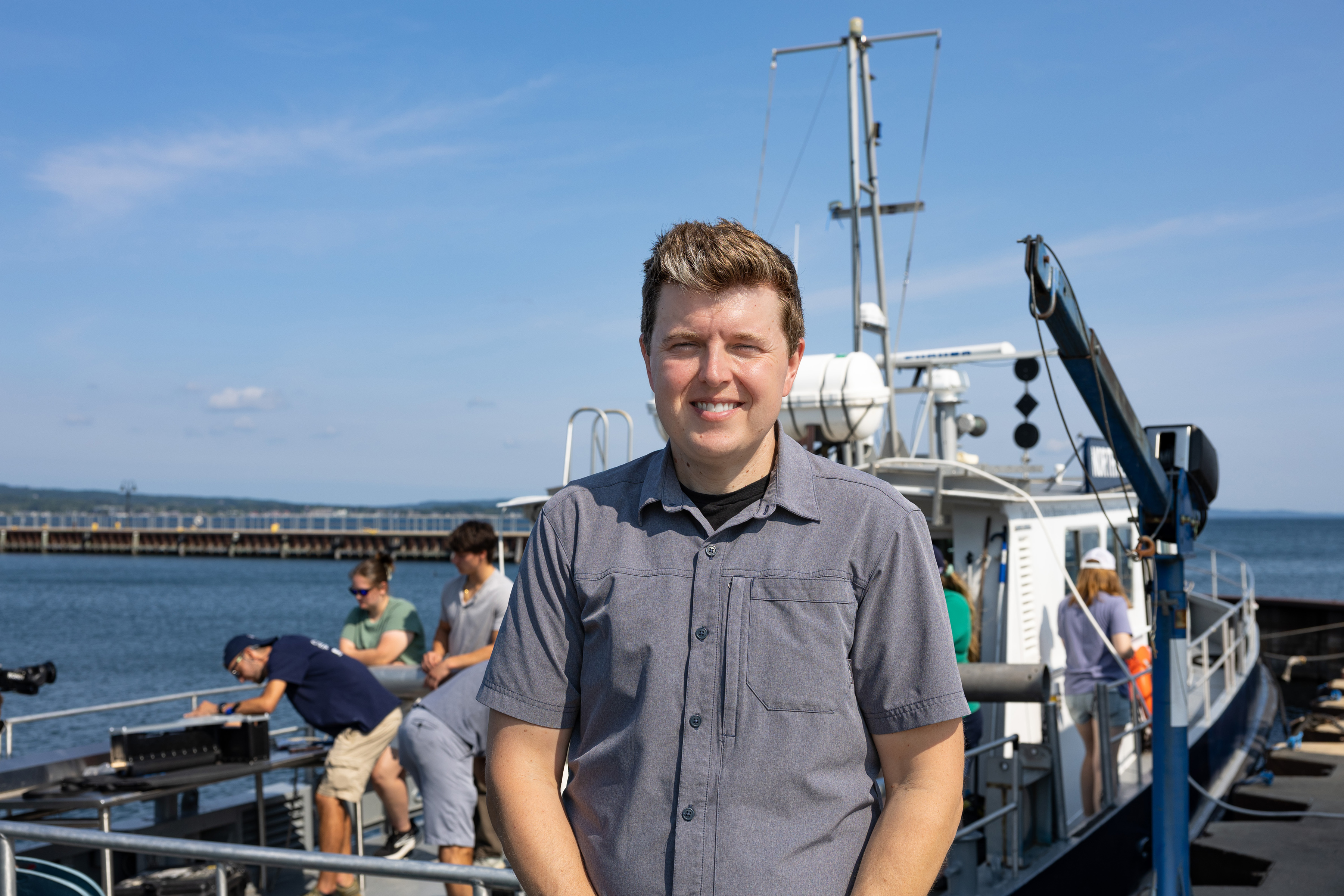 John Lutchko in front of the R/V Northwestern