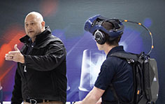An NMC Law Enforcement Program instructor works with a student in a virtual police academy training session