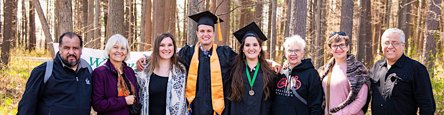 NMC students and family outside the 2021 Commencement ceremony at the Dennos Museum Center