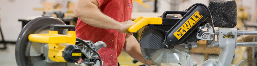 An NMC Construction Technology Program program student operates a table saw