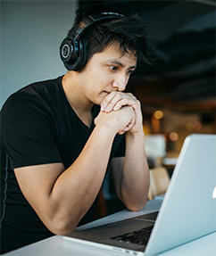 Student sitting at laptop. Photo by Wes Hicks on Unsplash