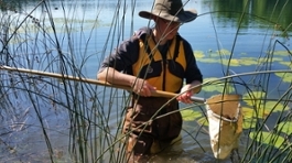 Woman with water measuring device
