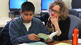 An NMC instructor teaches a student in an NMC Communications program course