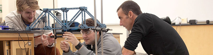 NMC Engineering program students and instructor work on an engineering problem