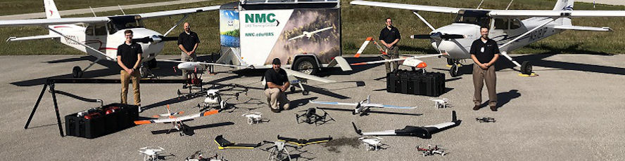 NMC Unmanned Aircraft Systems (UAS) program students and instructors pose with the fleet of drones and unmanned aerial vehicles