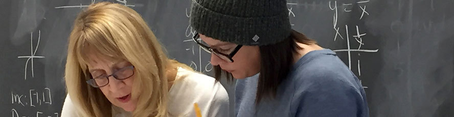 NMC Mathematics program instructor and student working on a math problem