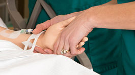 An NMC nursing student works on a medical simulator