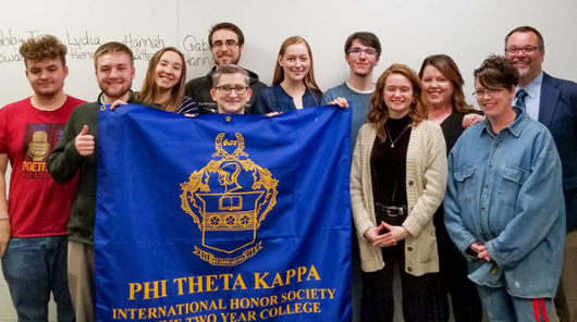 NMC students with welcome banners 