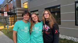 NMC students with welcome banners 
