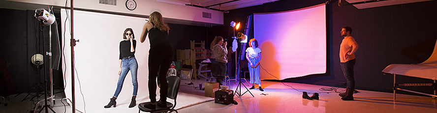 NMC Arts / Fine Arts program students conduct a photo shoot in the photo studio in the Fine Arts building