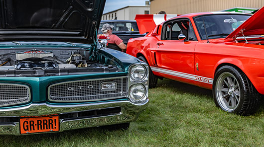 A Pontiac GTO and Ford Mustang at the 2026 Mike McIntosh Truck & Car Show