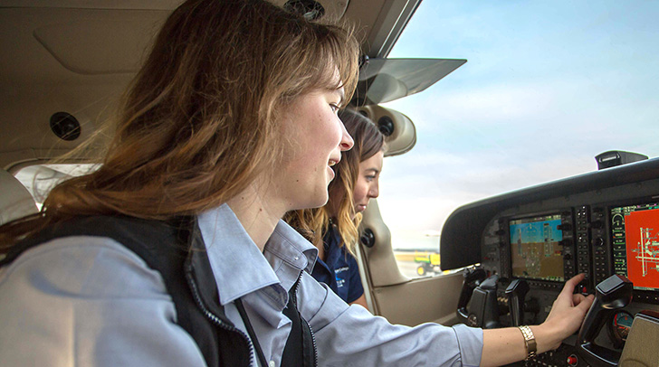 An NMC Aviation program instructor and student in the cockpit of one of the program's planes