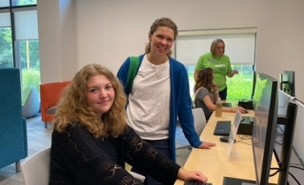 Academic students looking at computer