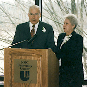 Art and Mary Schmuckal speak at the dedication ceremony for the University Center building that bears their name in May 1997